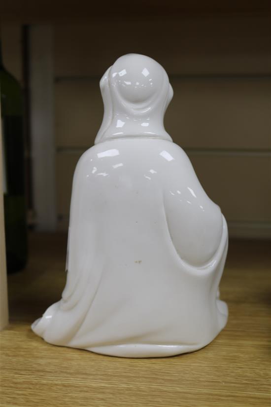 A Chinese blanc de chine seated figure of Guanyin H.21cm